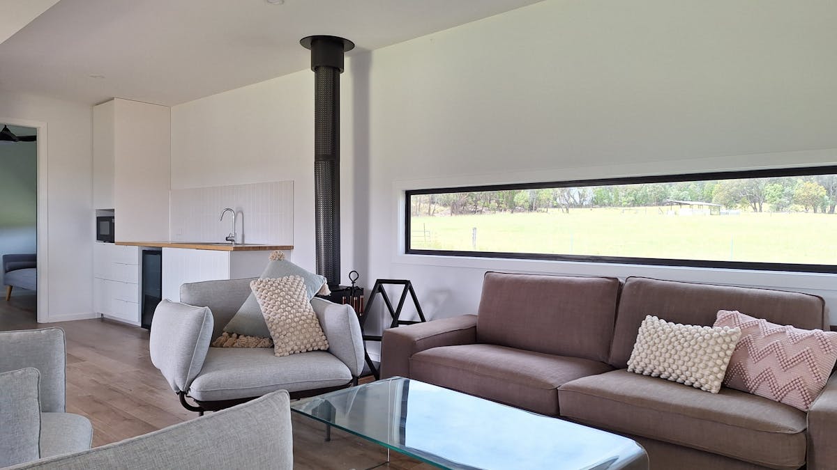 Our open plan living area, complete with fireplace provides the perfect setting to relax.