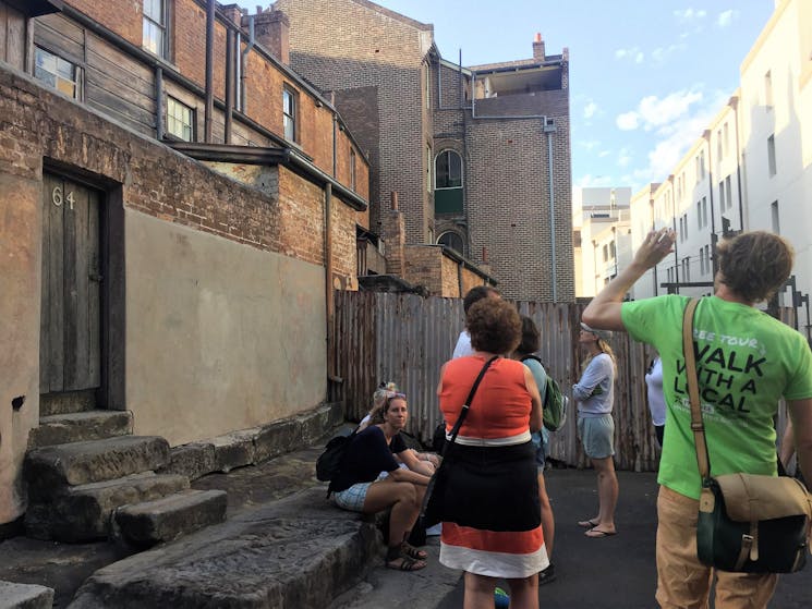 alt="The Rocks tour guide explaining history of Susannah Place"