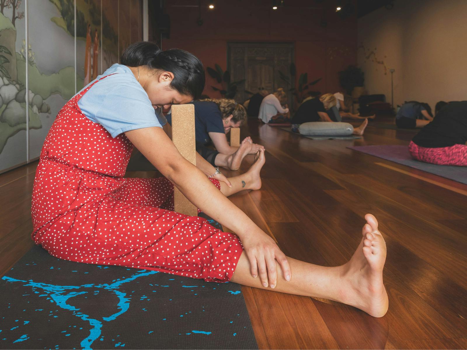 Woman seated in a yin yoga posture