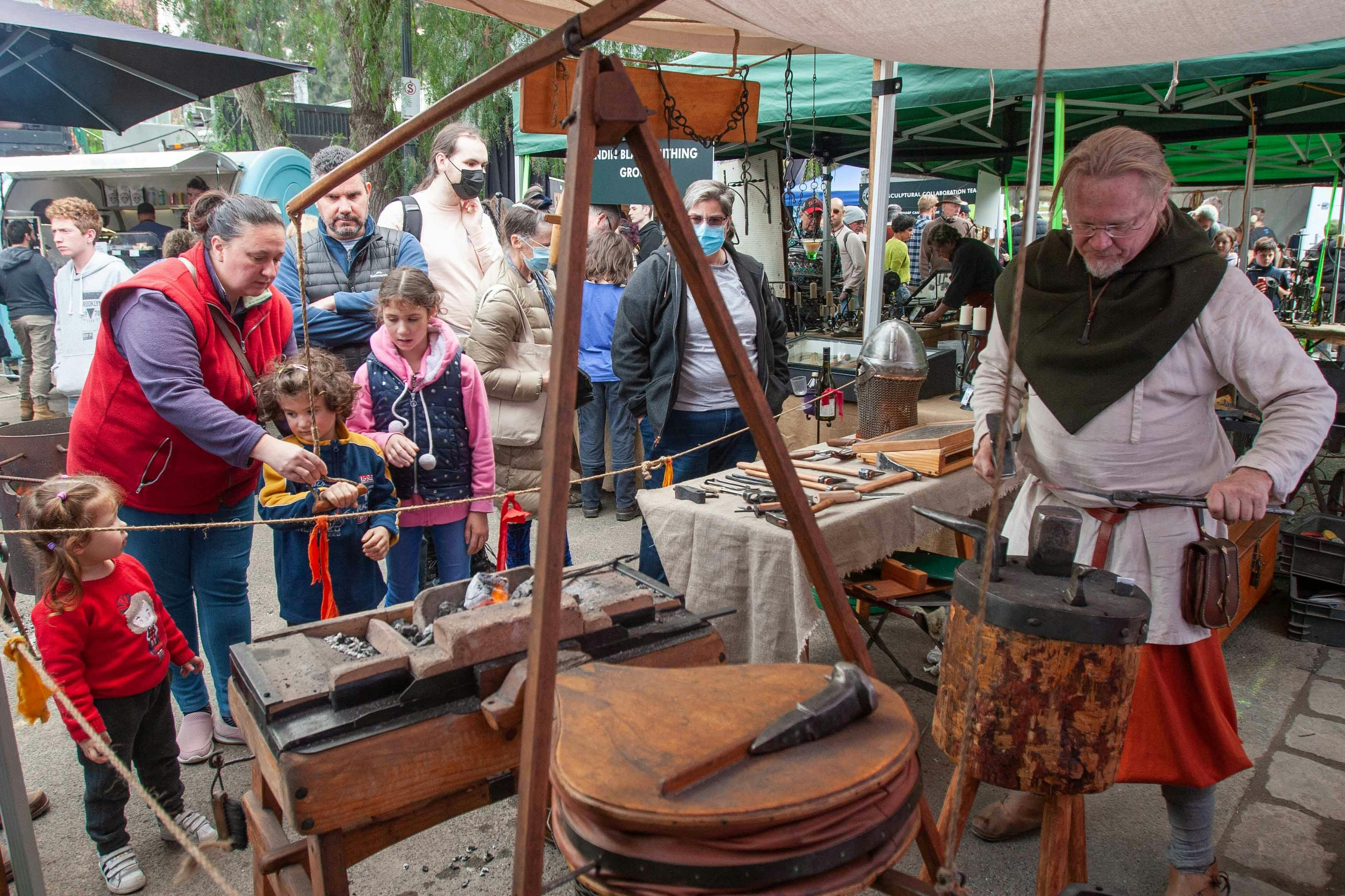 Bjorn Blacksmiths demonstrates traditional blacksmithing techniques, using a bellows powered forge.