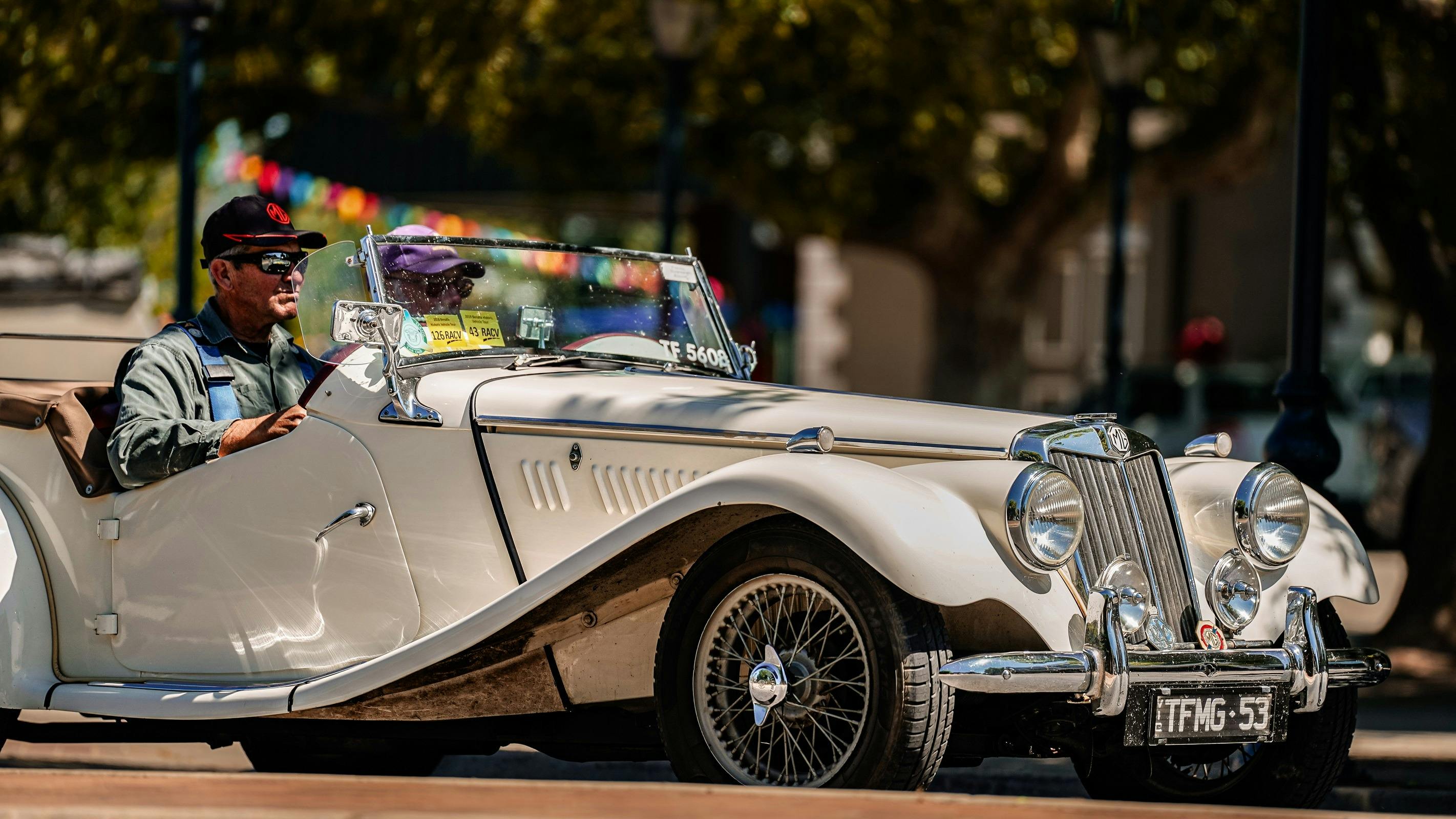 White vintage car driving the streets of Benalla