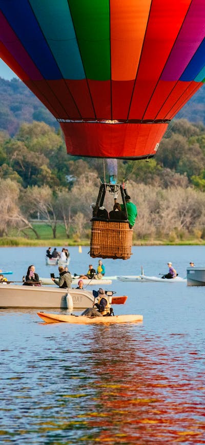 Balloon from Canberra Balloon Spectacular hovering over the water