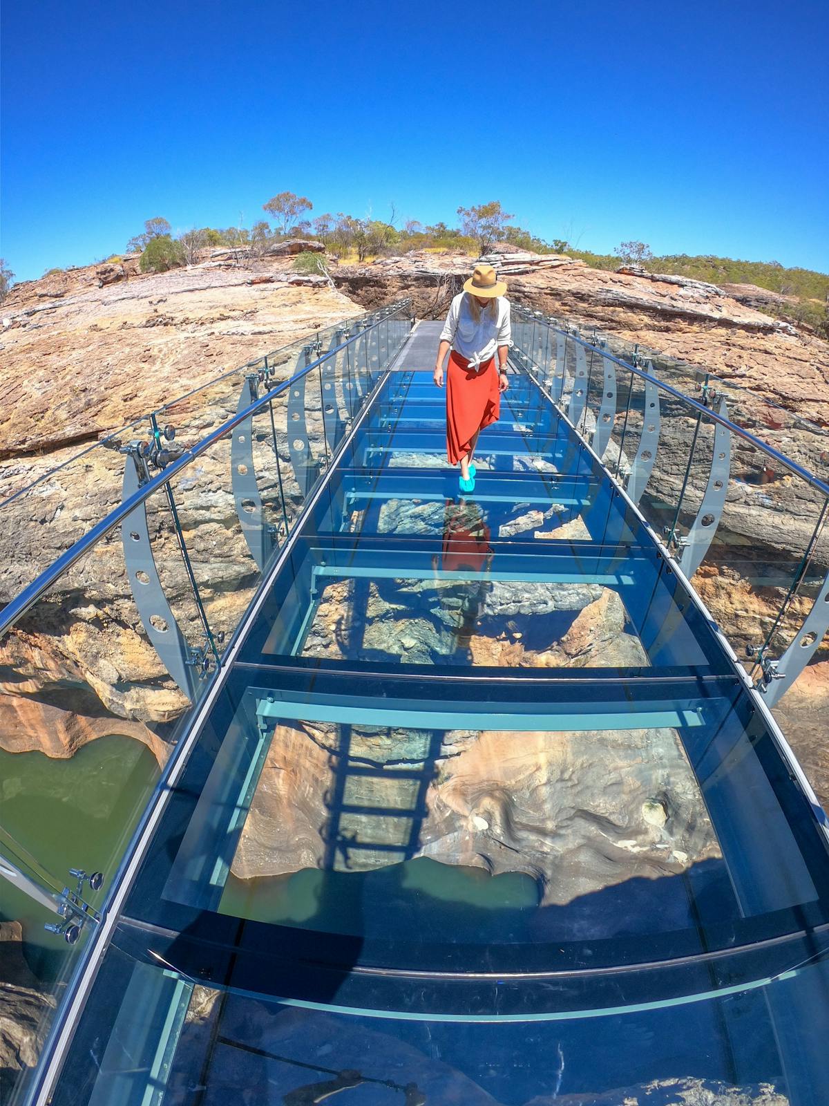 Walking across glass bridge