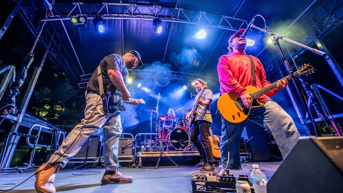 Band members of Beddy Rays on stage singing
