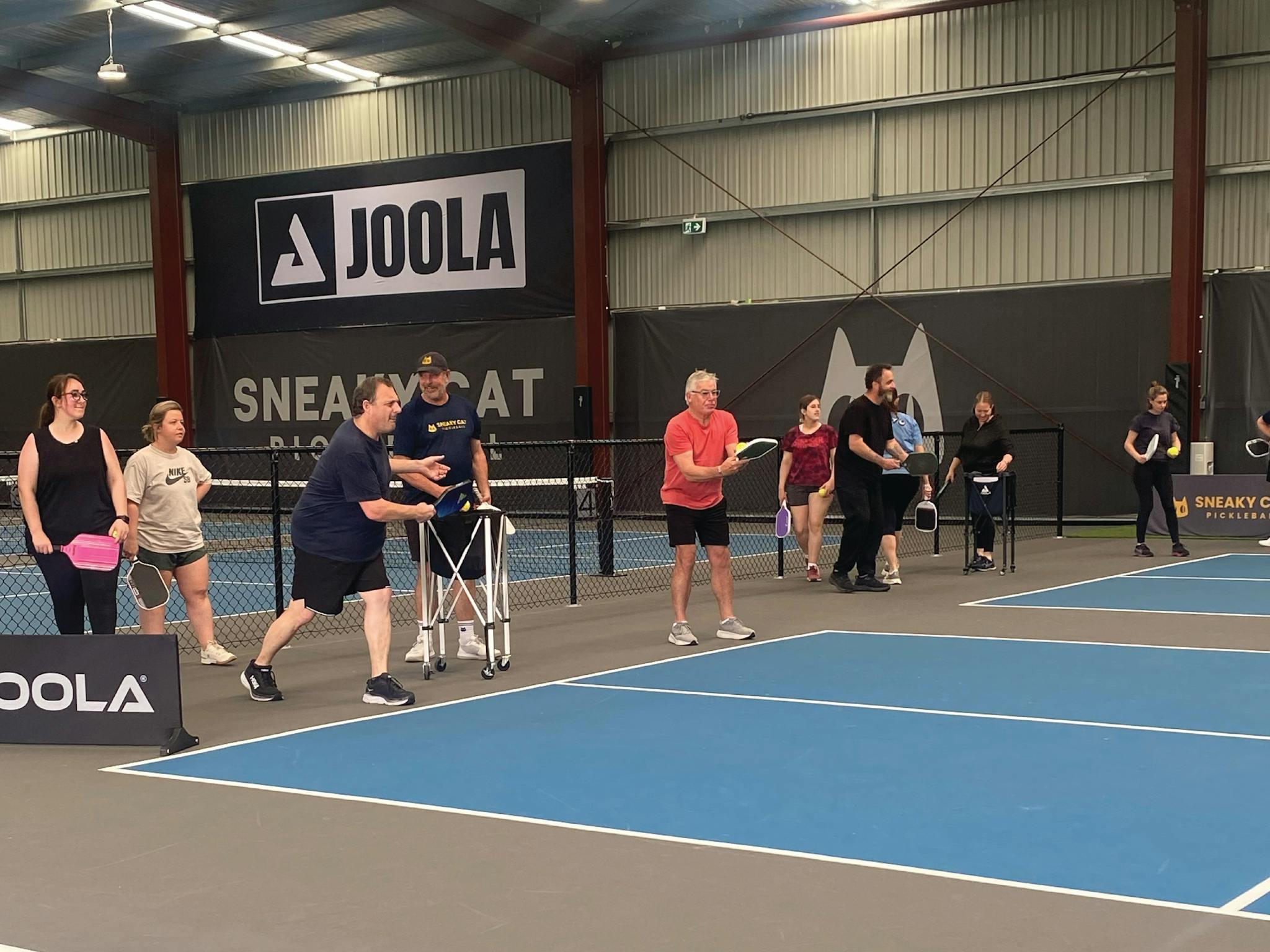 Participants  doing pickleball drills at Sneaky Cat Pickleball.