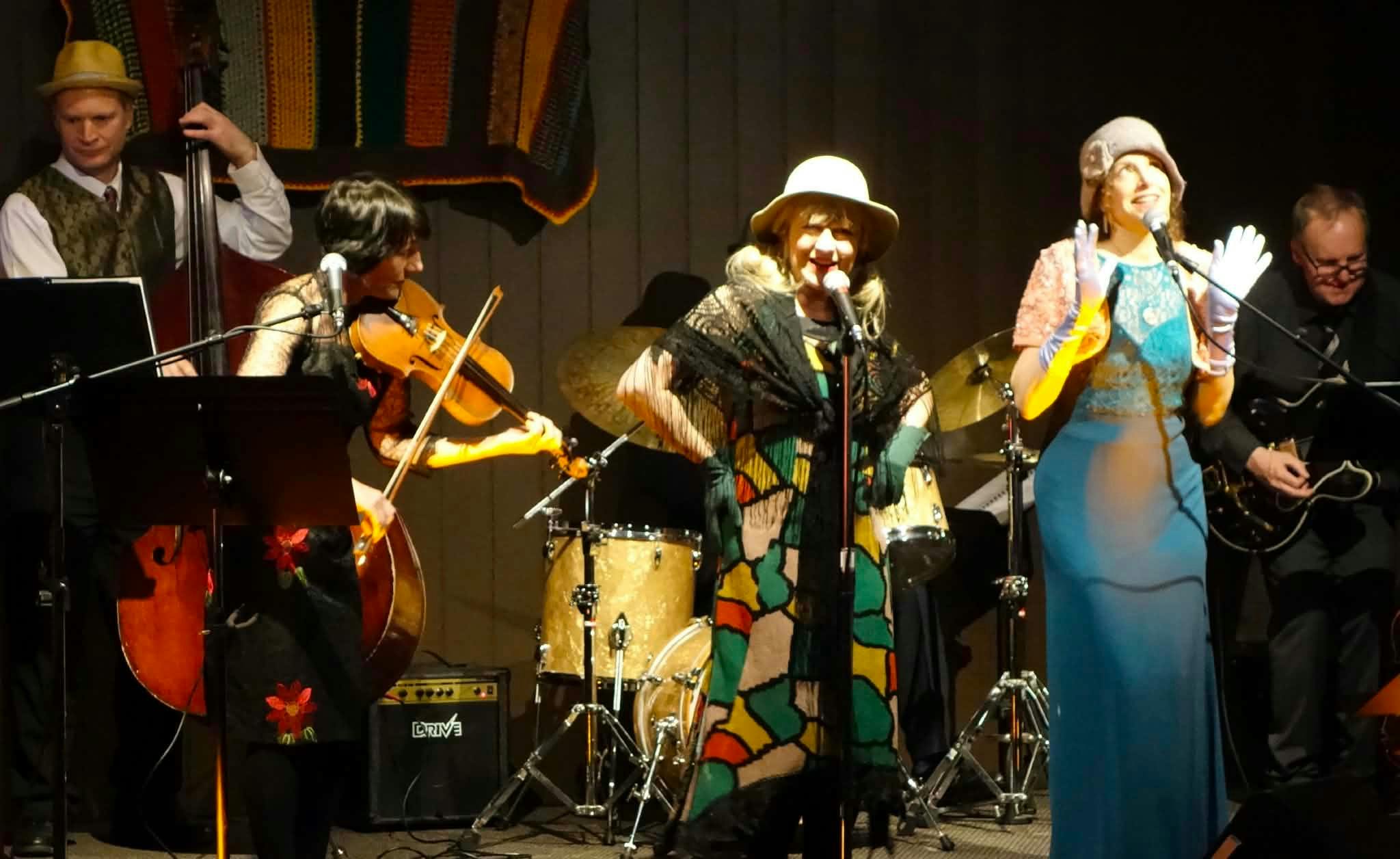 Band photo with two singer and violinist