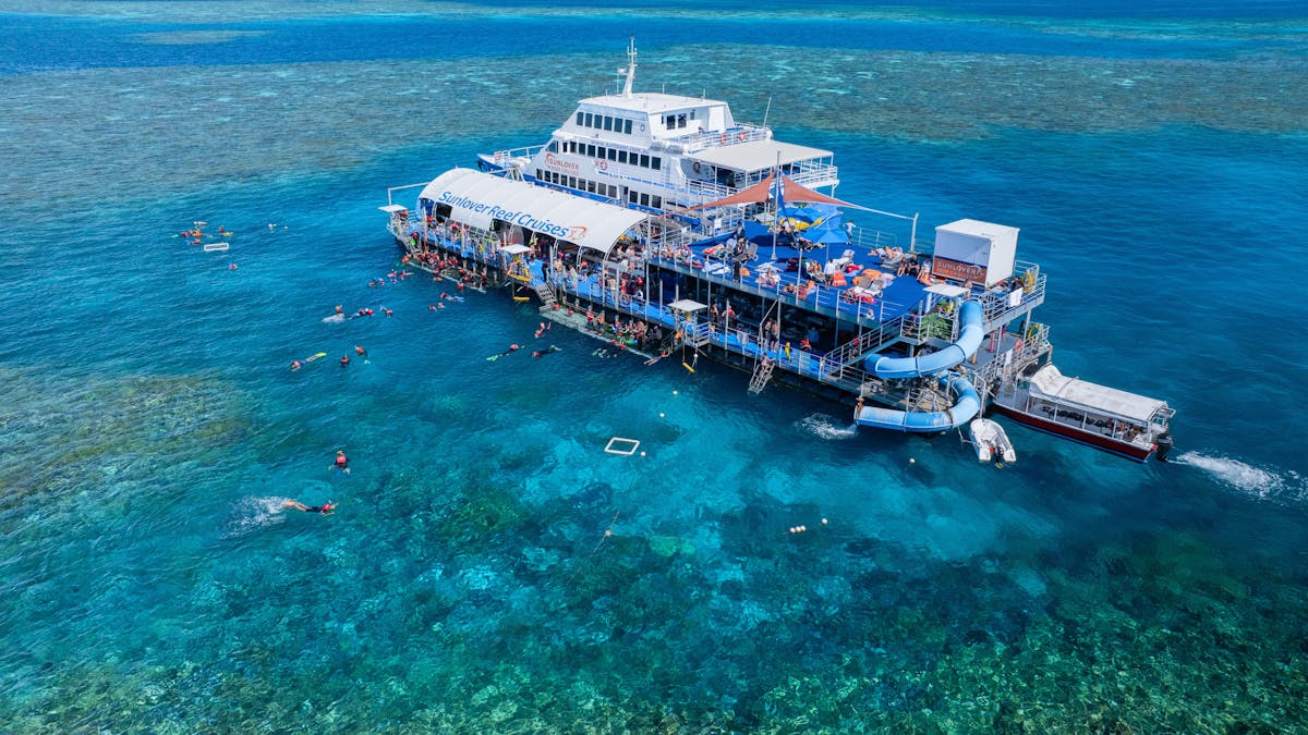 Sunlover Reef Cruises’ Moore Reef pontoon on the Great Barrier Reef, with the reefs only waterslide