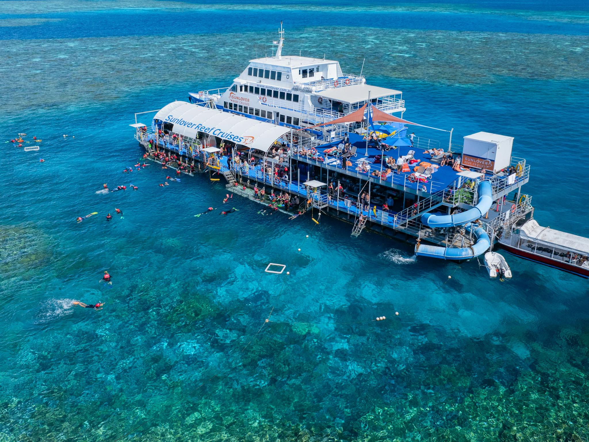 Sunlover Reef Cruises’ Moore Reef pontoon on the Great Barrier Reef, with the reefs only waterslide