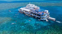 Sunlover Reef Cruises’ Moore Reef pontoon on the Great Barrier Reef, with the reefs only waterslide