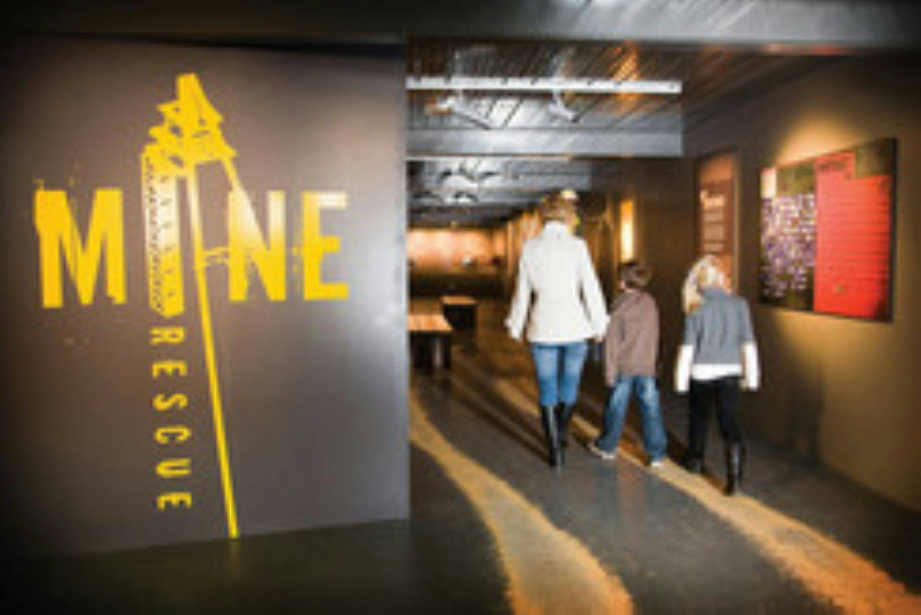 People walking into a museum