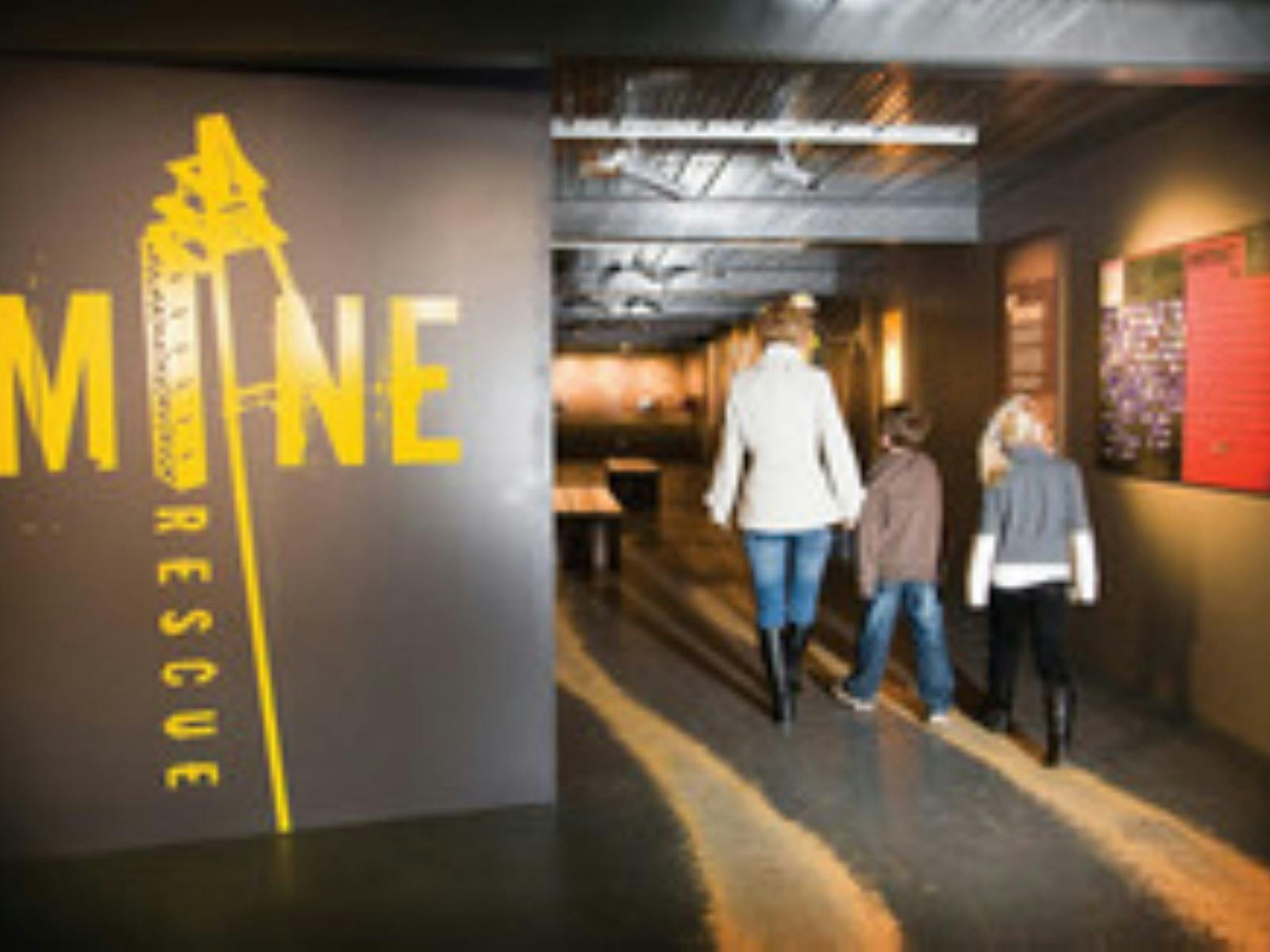 People walking into a museum