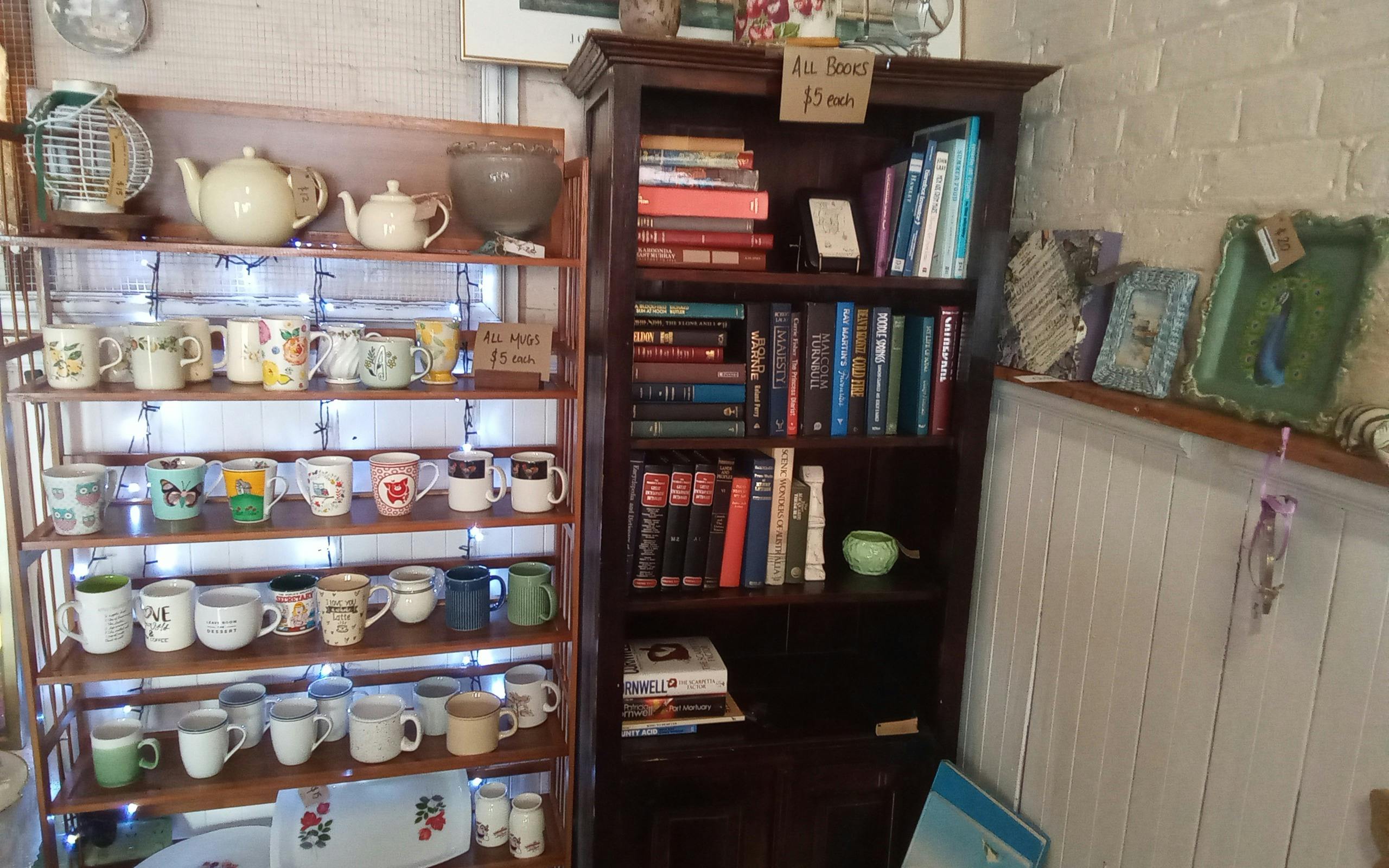 Mug wall and book shelves.