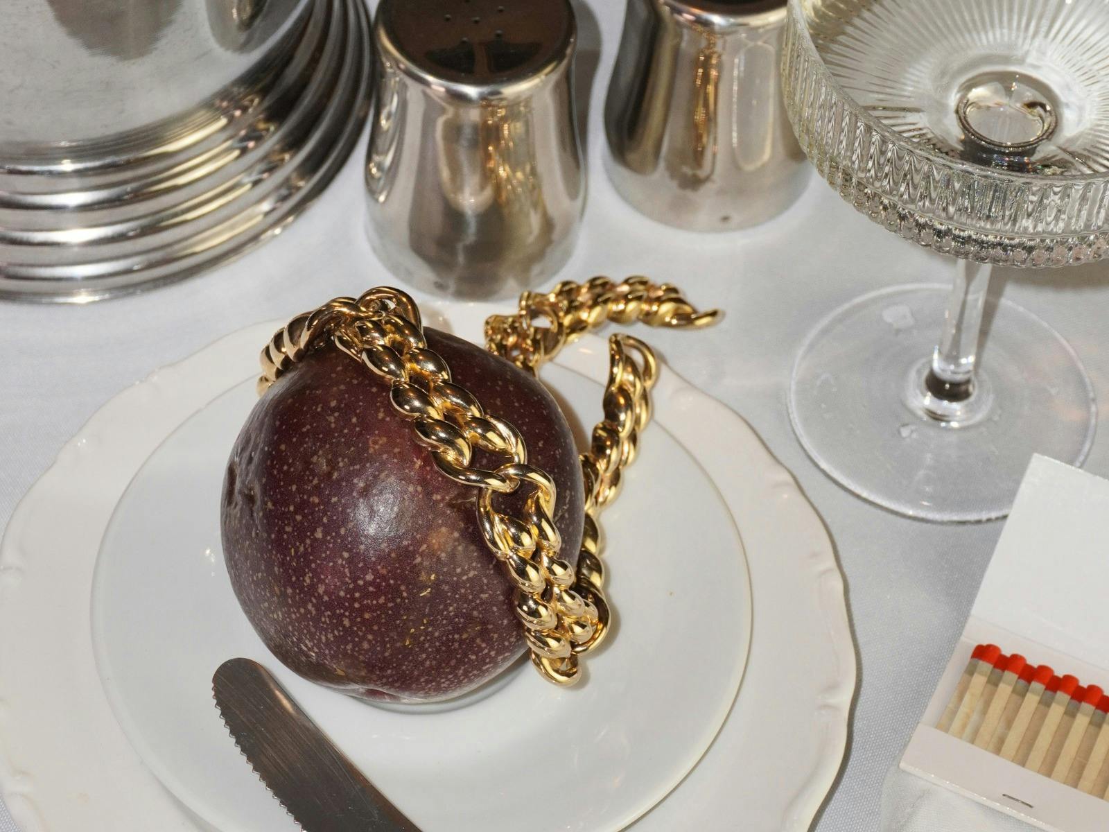 Dinner Party with fruit and gold necklace