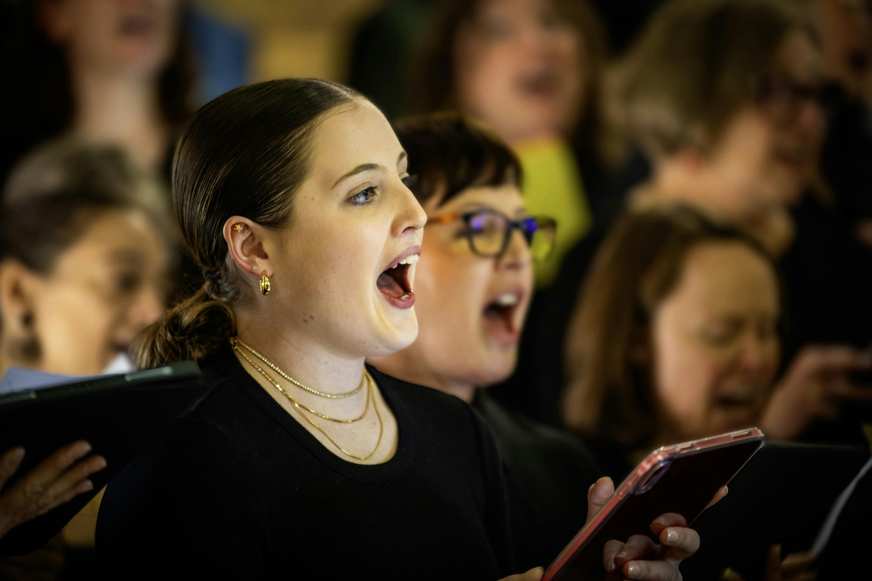 Mixed age group vocal workshop attendees singing at the Merimbula Jazz Festival a performance