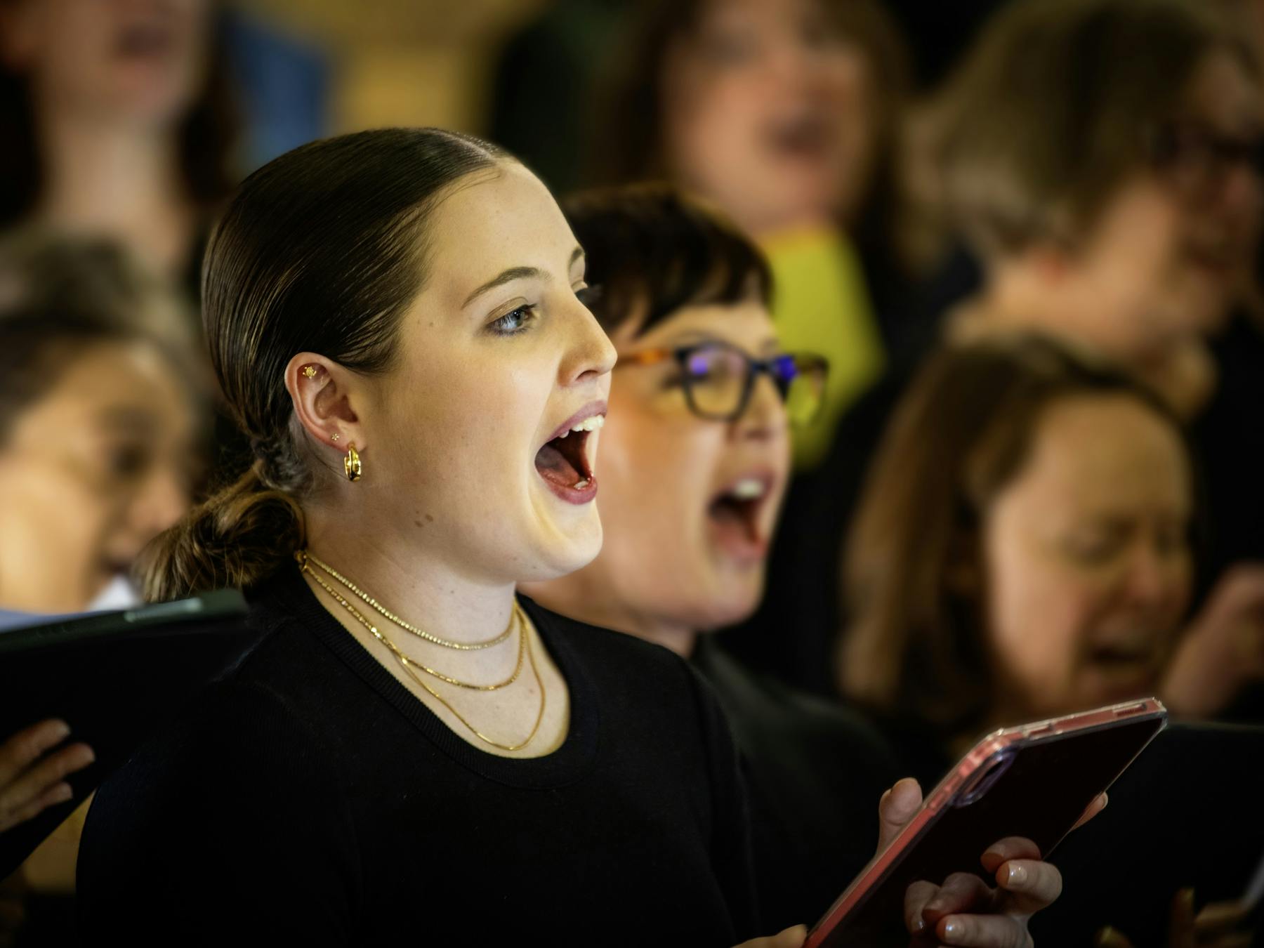 Mixed age group vocal workshop attendees singing at the Merimbula Jazz Festival a performance