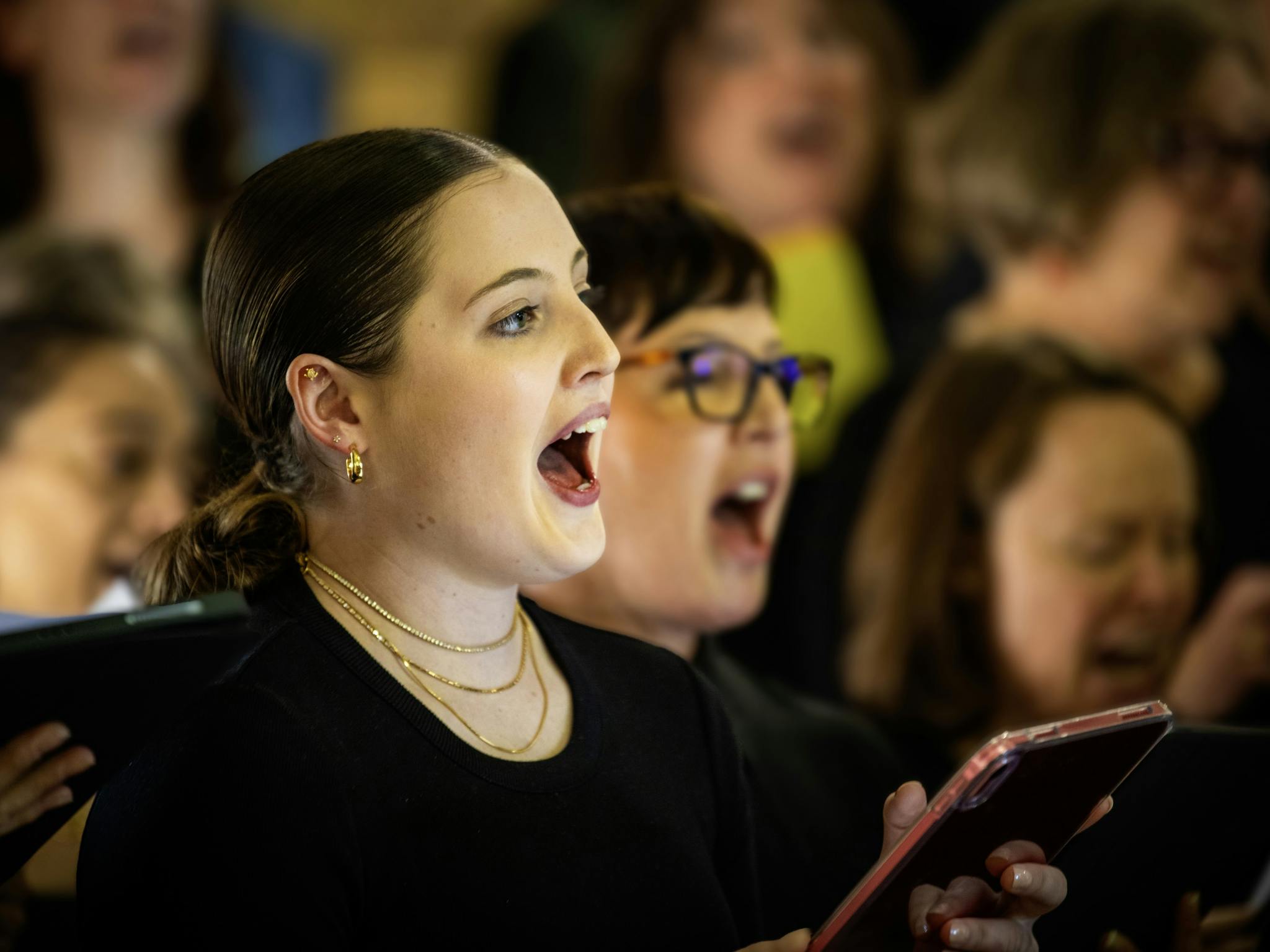 Mixed age group vocal workshop attendees singing at the Merimbula Jazz Festival a performance