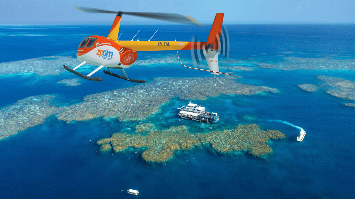 Zoom Helicopters flying over Moore Reef on the Great Barrier Reef.