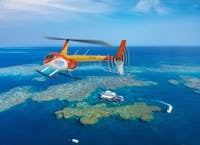 Zoom Helicopters flying over Moore Reef on the Great Barrier Reef.