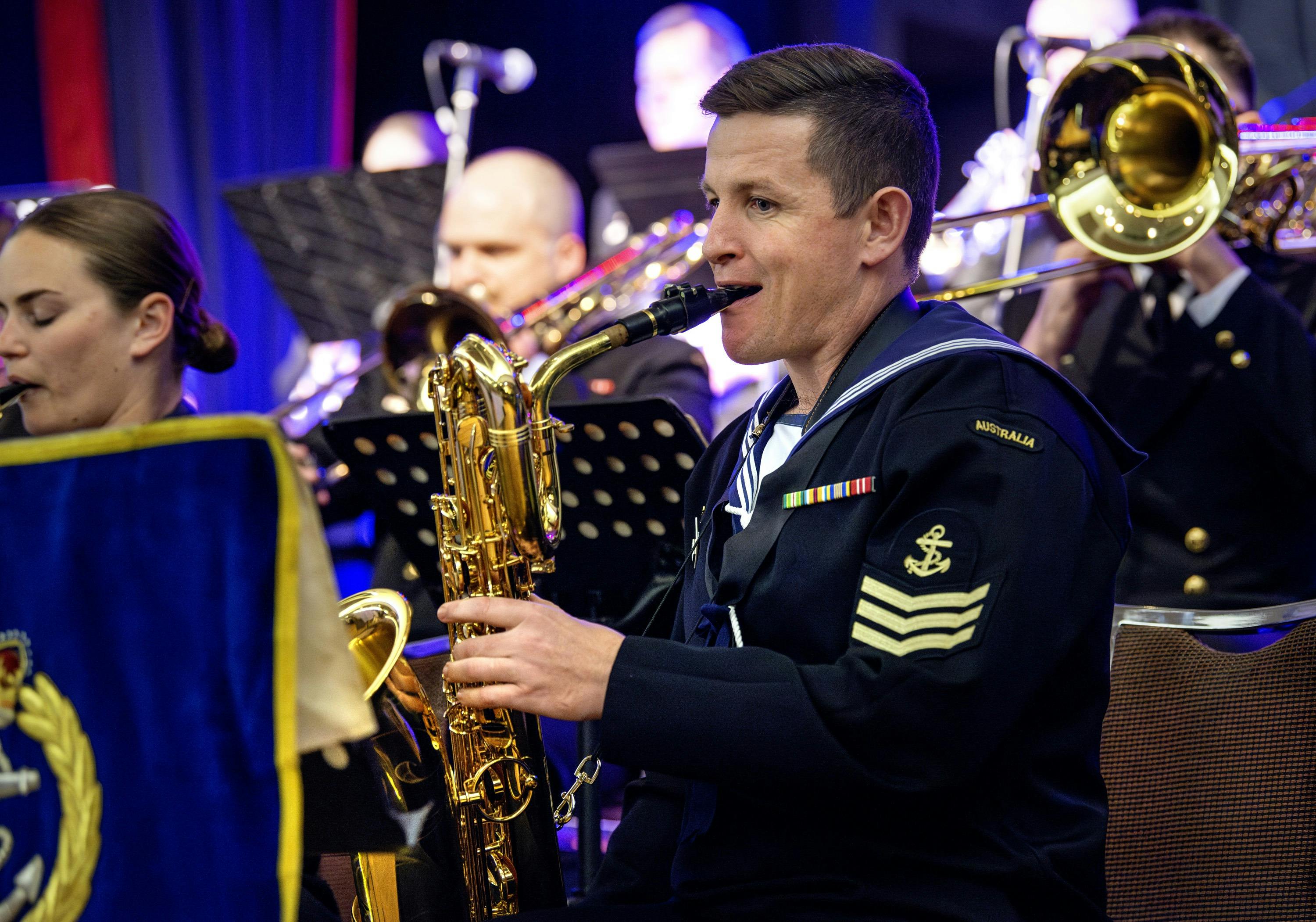 Front line sax players in the Australian Royal Navy Big Band at Merimbula Jazz Festival.b