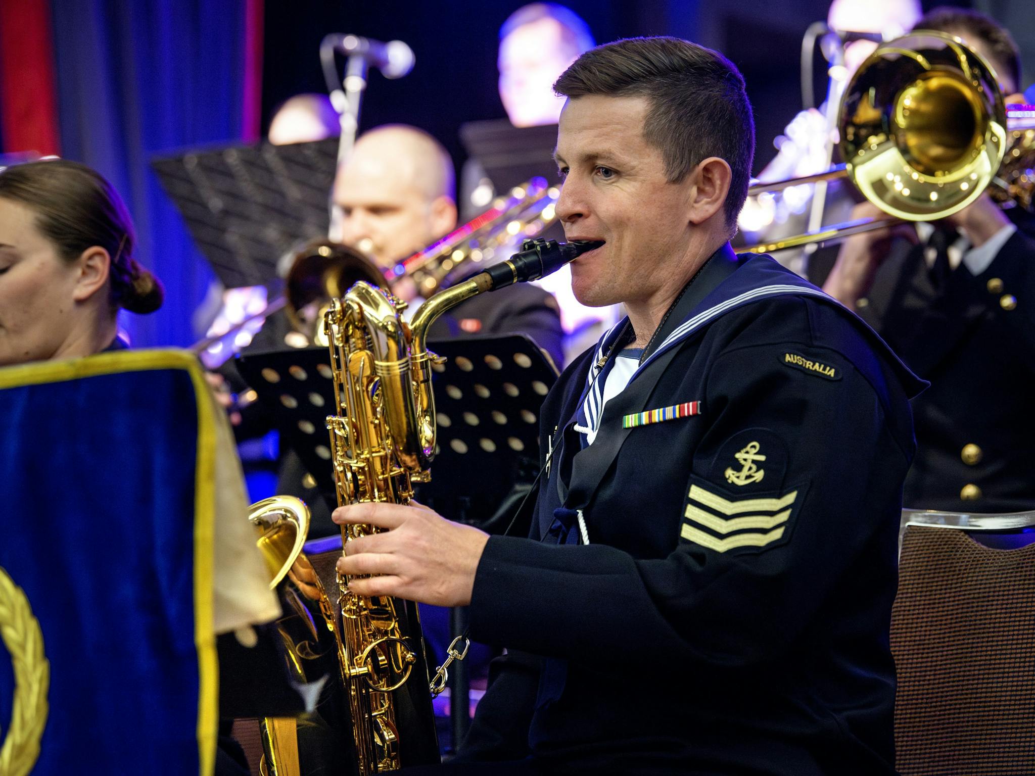 Front line sax players in the Australian Royal Navy Big Band at Merimbula Jazz Festival.b