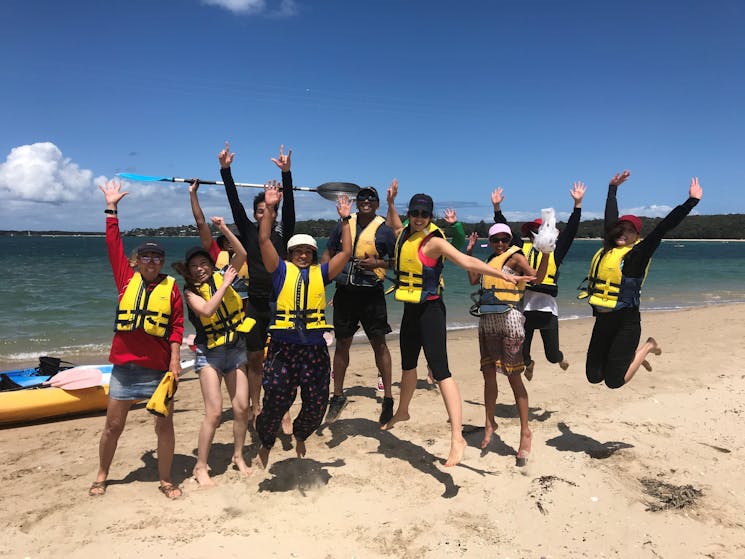 Kayak tour group on the sandspit in Bundeena