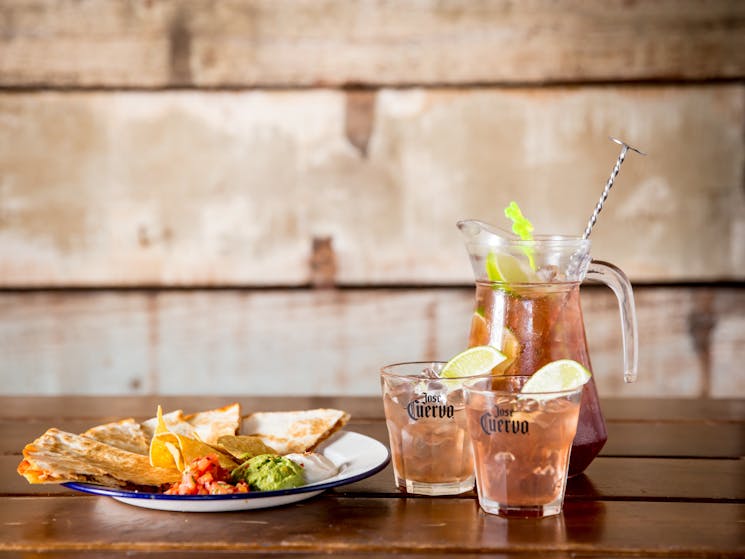 Chicken quesadilla with guacamole, pico de gallo, sour cream and a jug of Spicy Pirates!