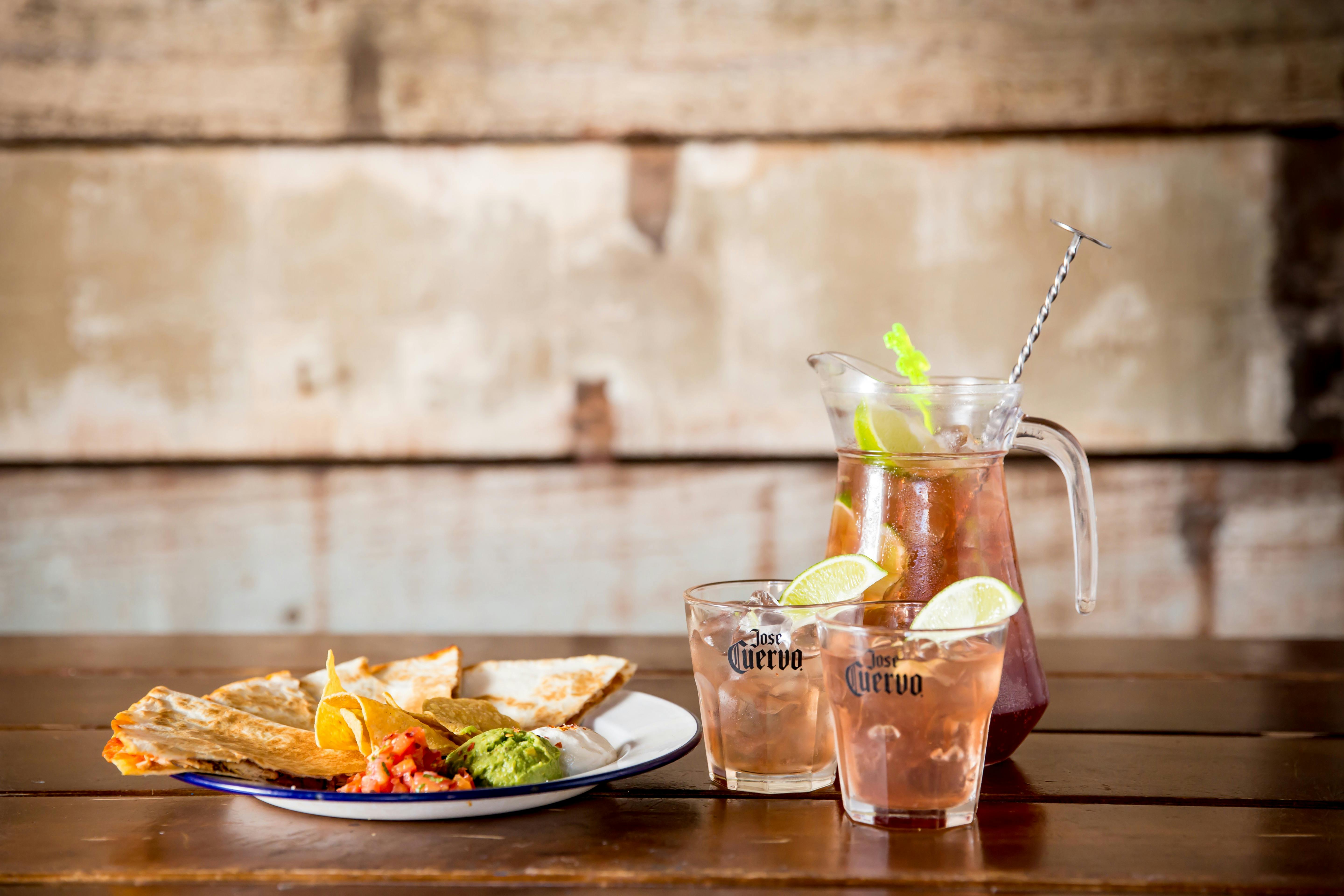 Chicken quesadilla with guacamole, pico de gallo, sour cream and a jug of Spicy Pirates!