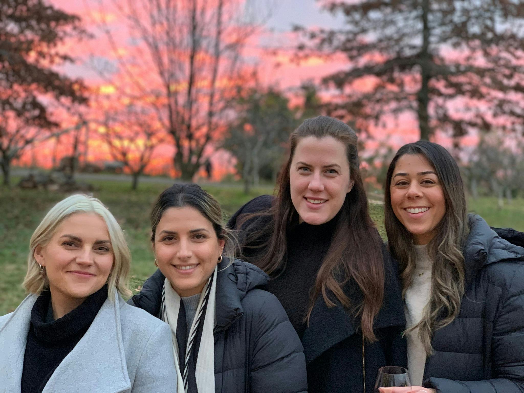4 ladies with sunset in background