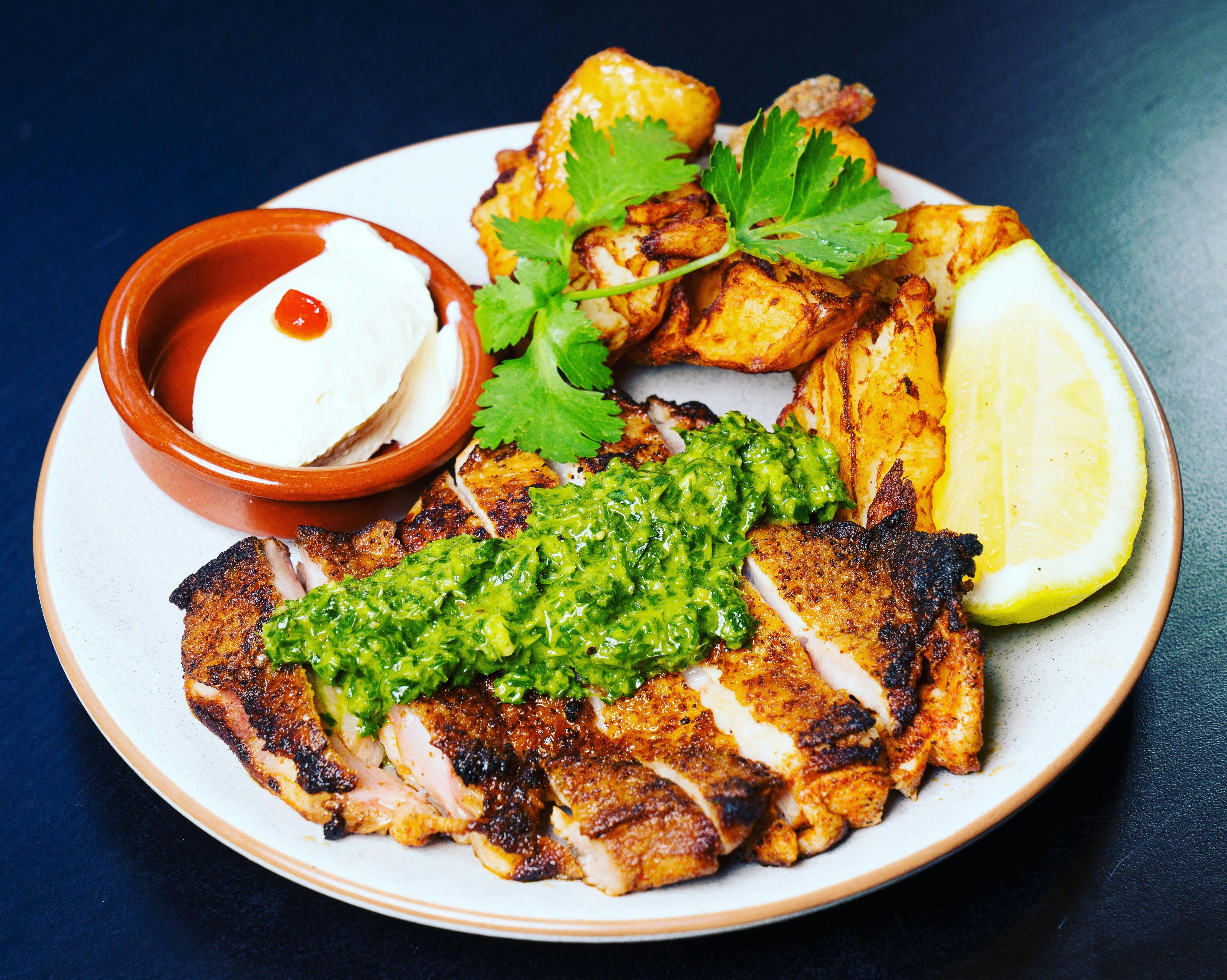 Peruvian marinated, free range leg fillet, served with salsa verde, potatoes, sour cream & lime.