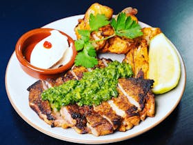 Peruvian marinated, free range leg fillet, served with salsa verde, potatoes, sour cream & lime.