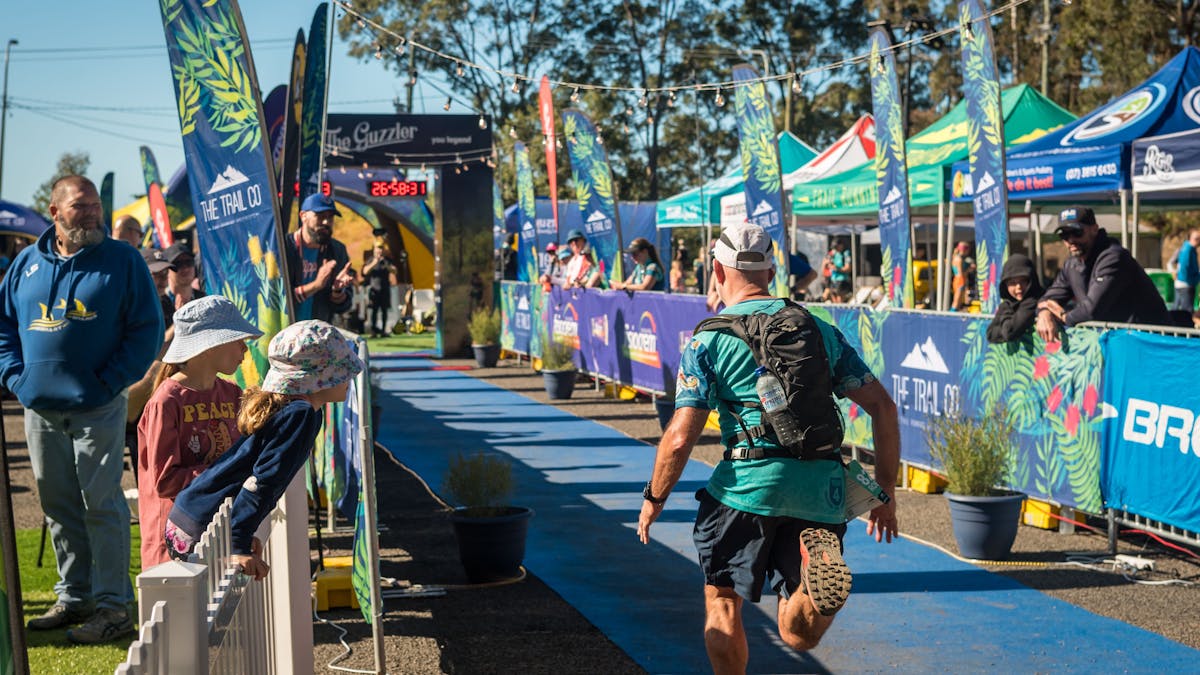 The Guzzler Ultra Finish chute lined with flags, spectators and tents