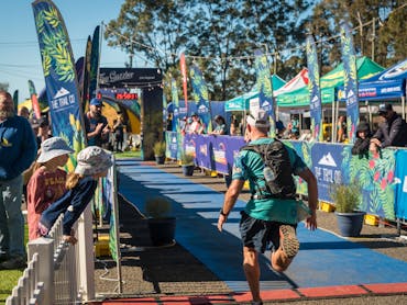 The Guzzler Ultra Finish chute lined with flags, spectators and tents