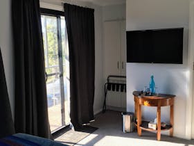 This room has a wardrobe, large screen TV with Netflix and door out onto the balcony