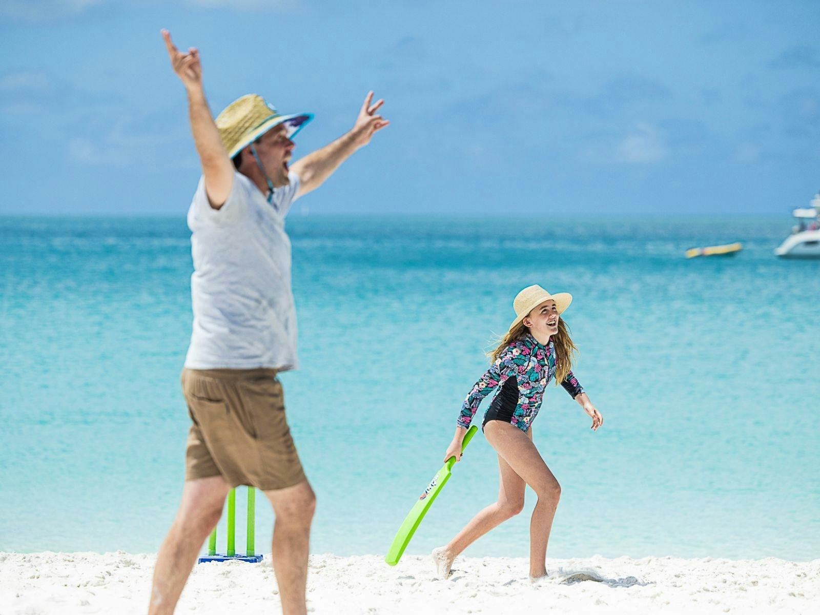 A family playing on the beach