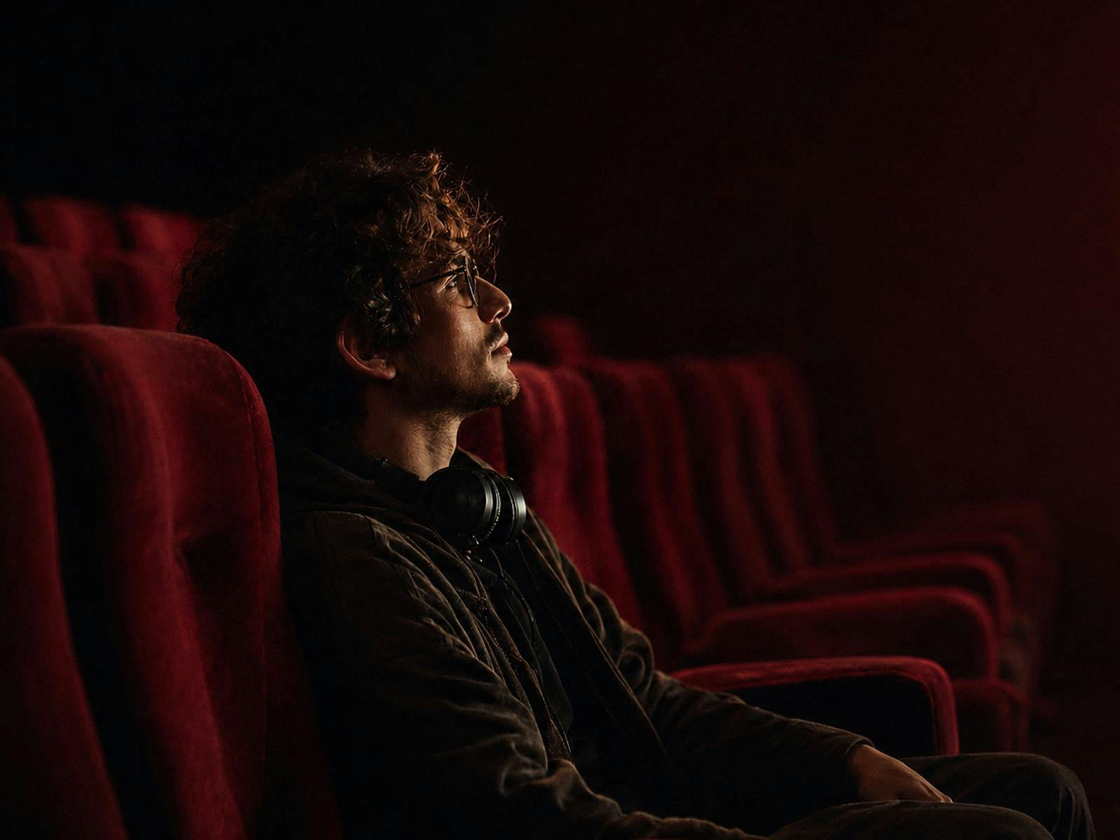 Man in theater with headphones