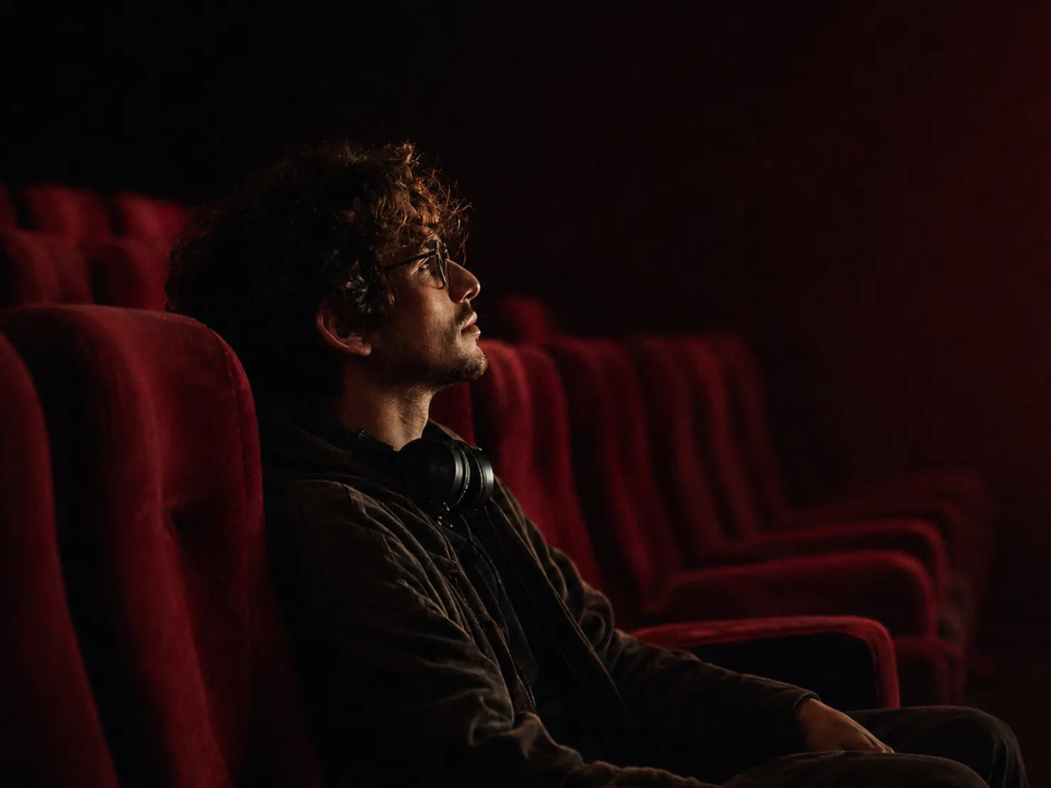 Man in theater with headphones