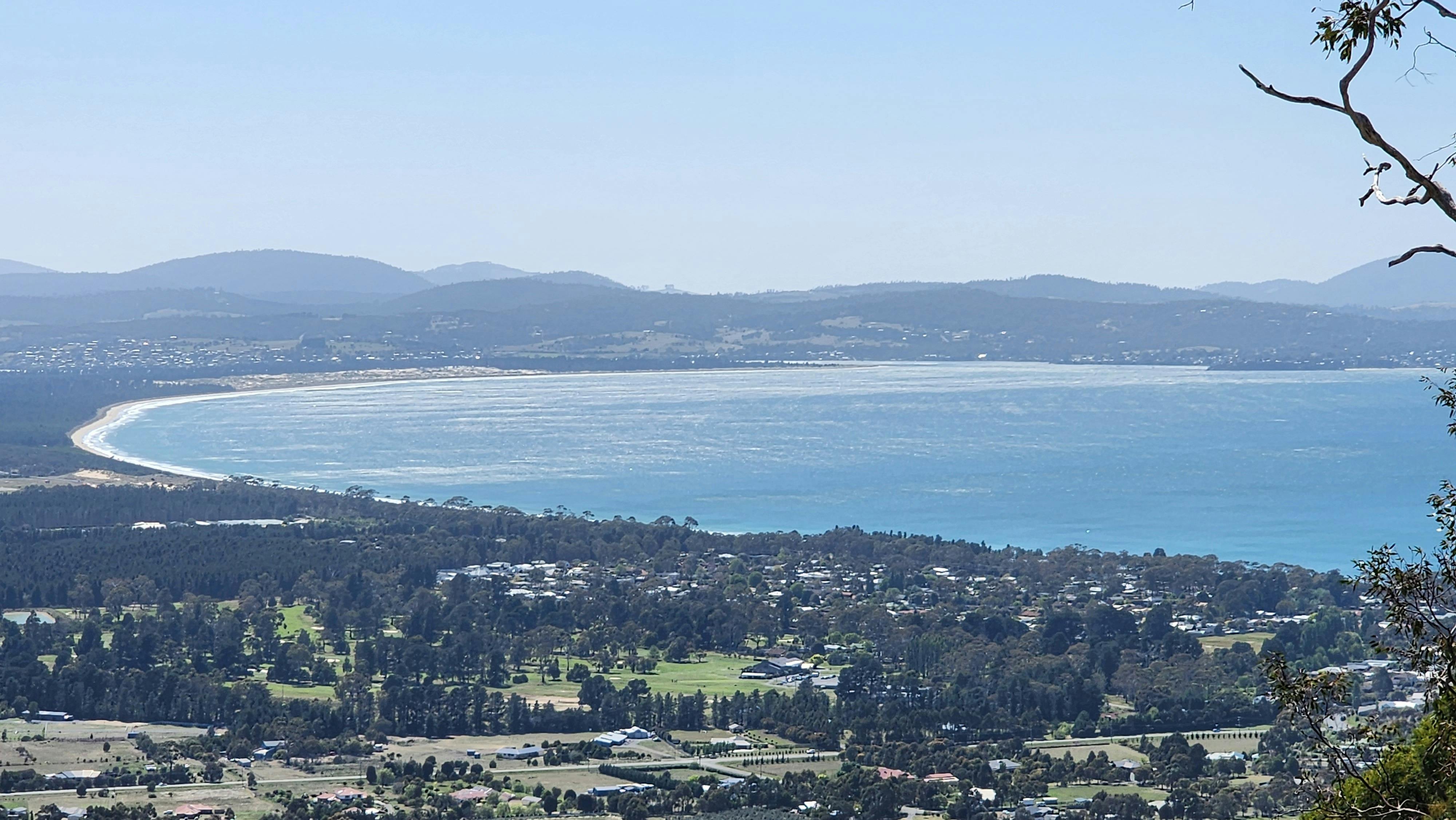 Elevated view across Hobart, coastline and surrounding Tasmanian landscape