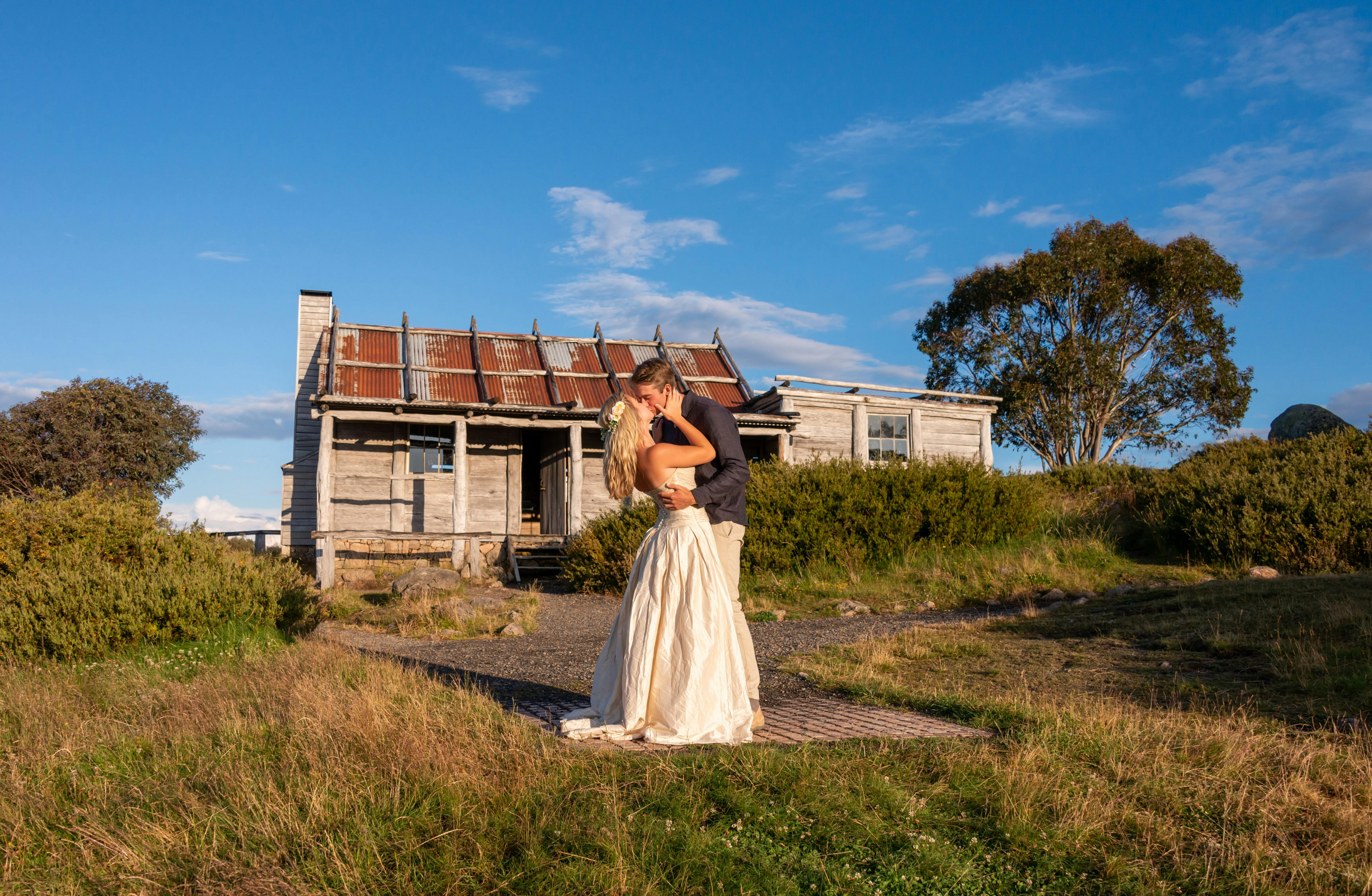 Just married couple sealed their marriage with a kiss with Craig's Hut as a backdrop.