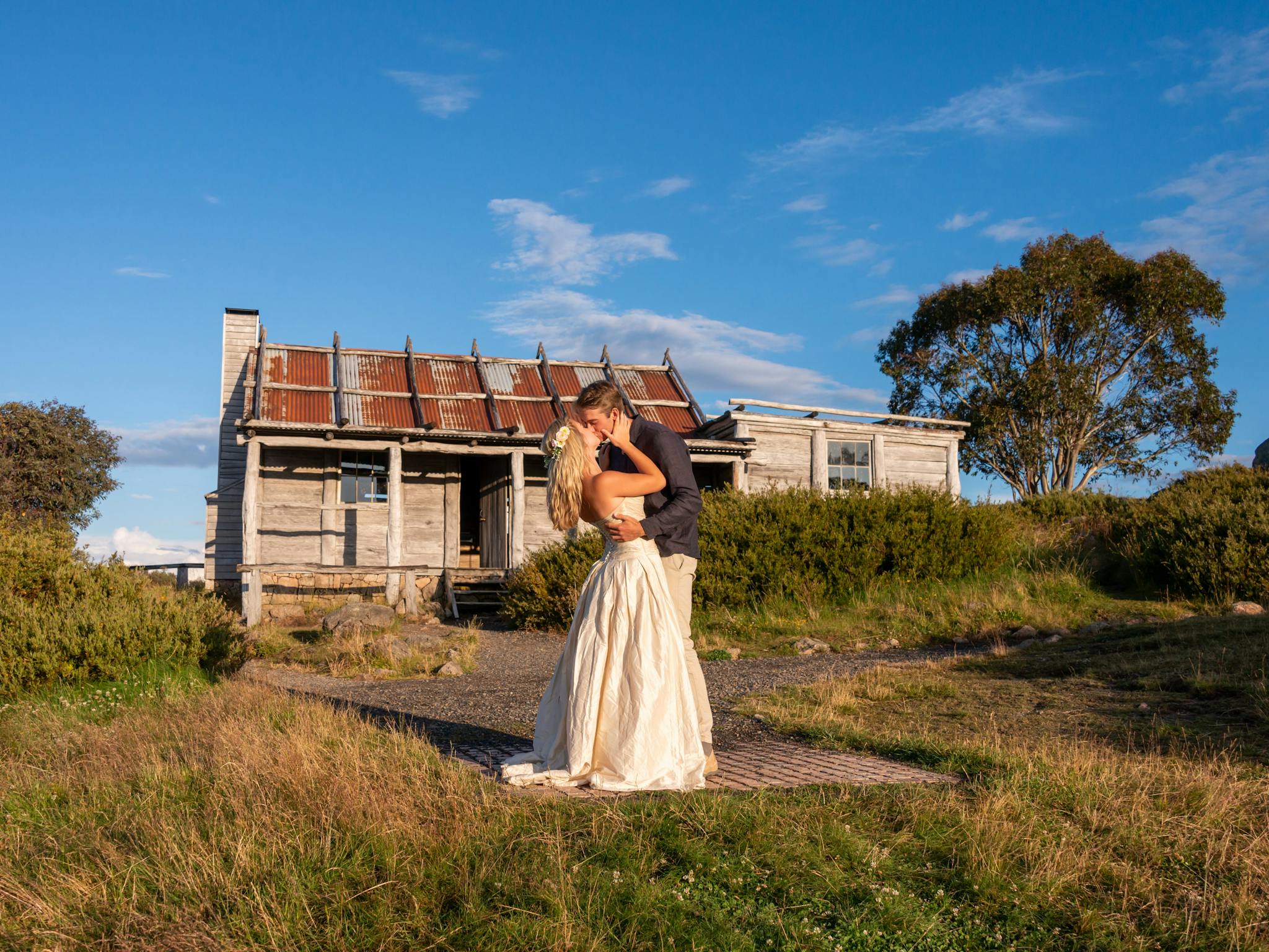 Just married couple sealed their marriage with a kiss with Craig's Hut as a backdrop.