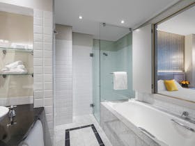 All bathrooms feature separate full size bath, shower, toilet and vanity. Incl bathrobe & amenities