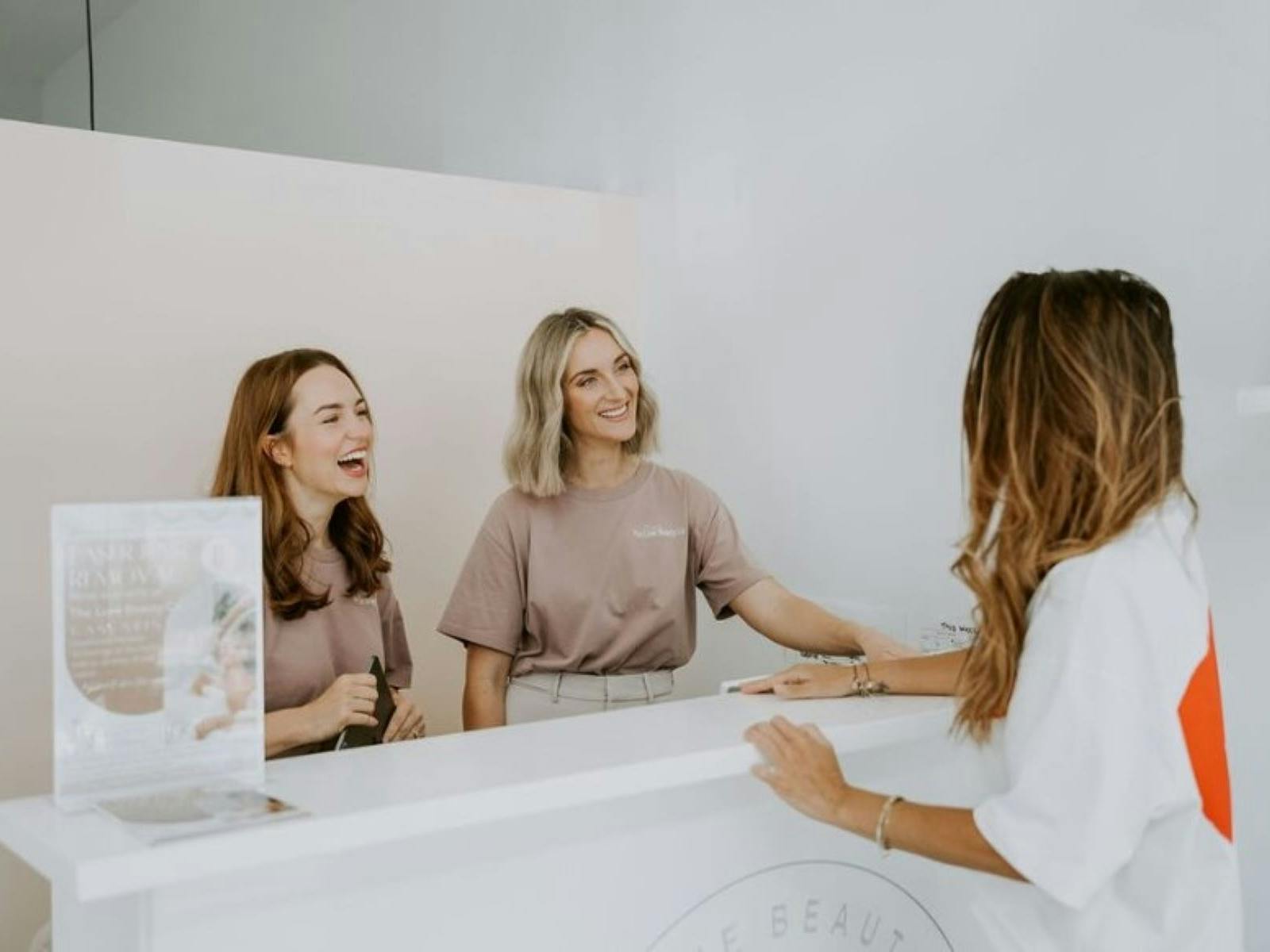 Beauticians meeting client