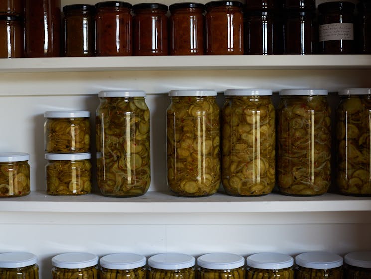 Yambulla pantry with shelves of various pickles and jams