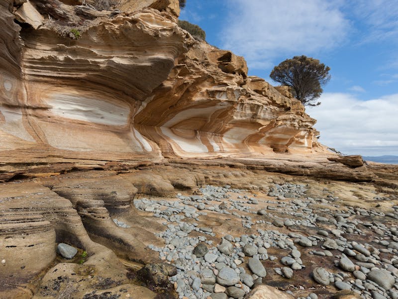 Painted cliffs on Maria Island, beautiful sandstone rock face that arches around