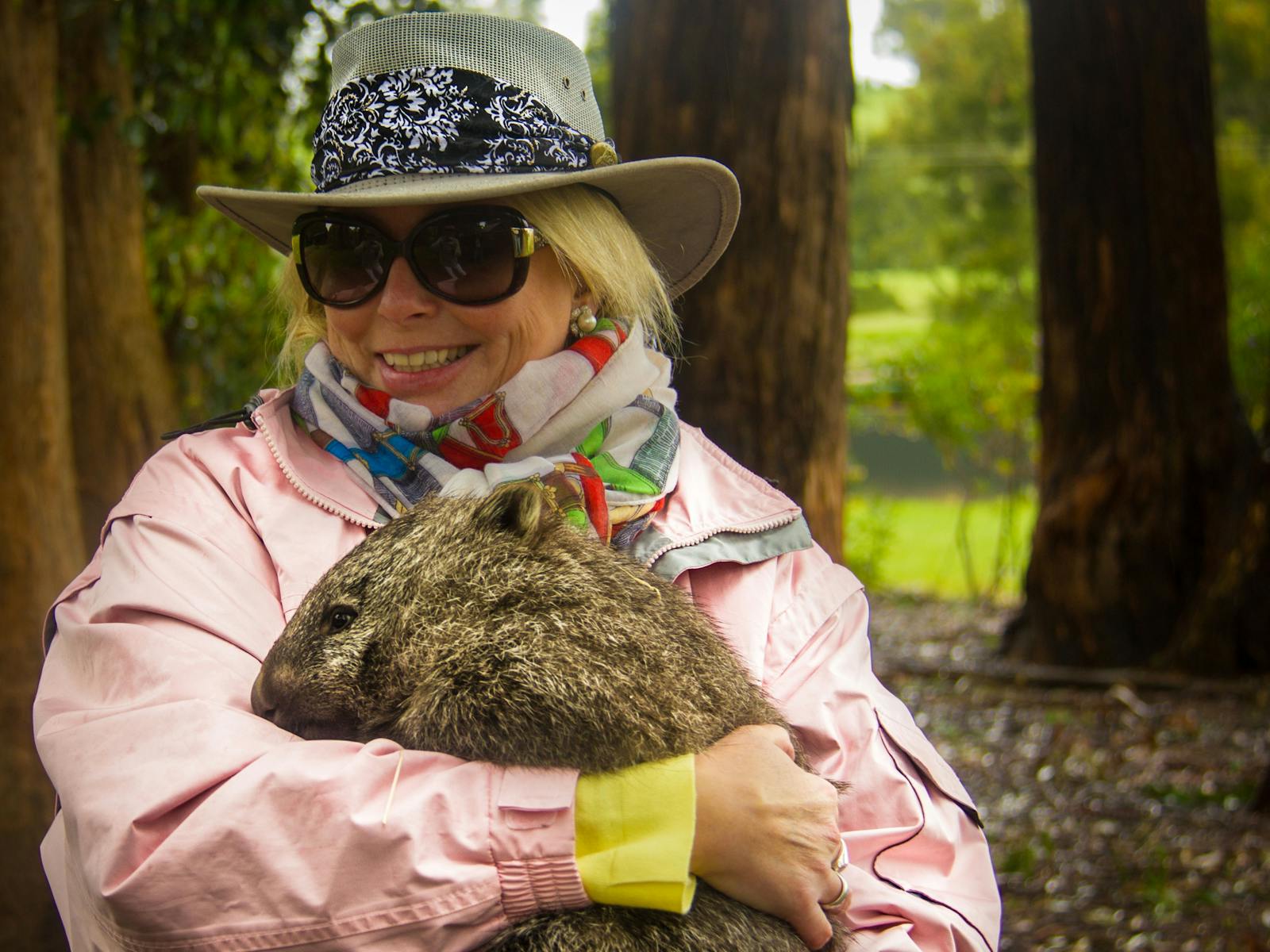 lady cuddling a wombat