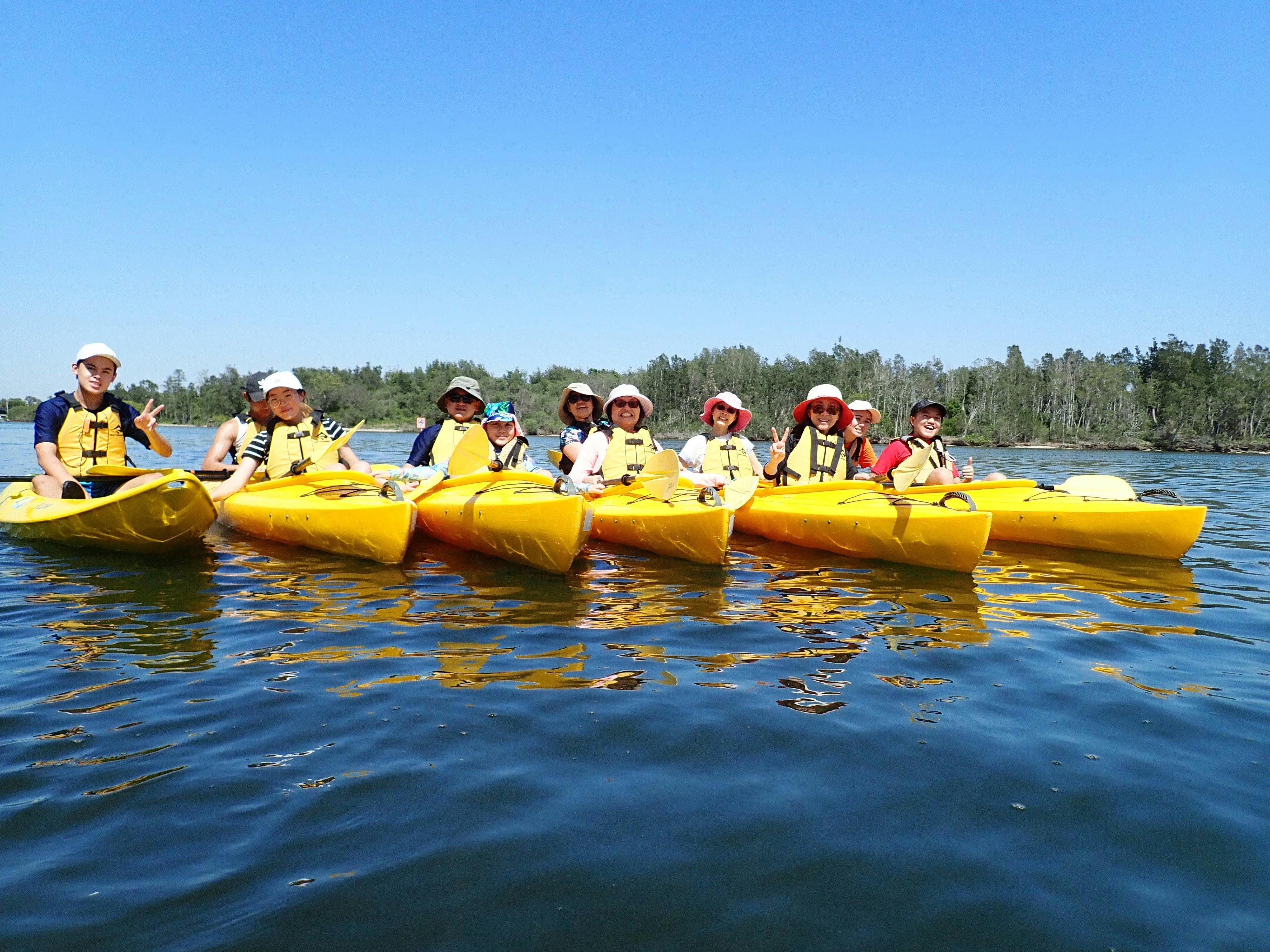 Group of six kayaks on the Myall River Discovery Tour