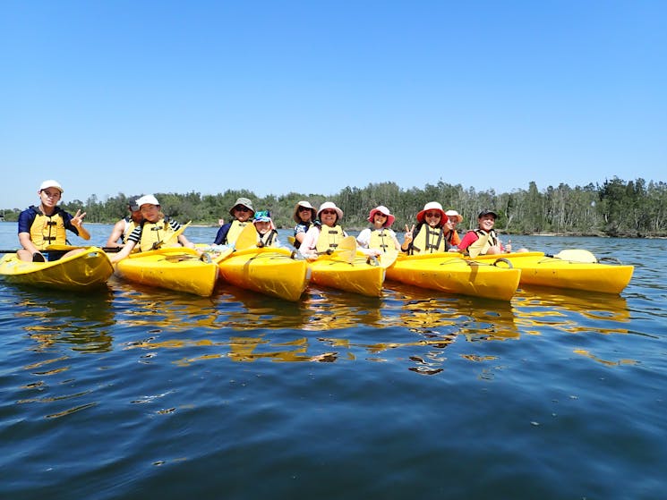 Group of six kayaks on the Myall River Discovery Tour