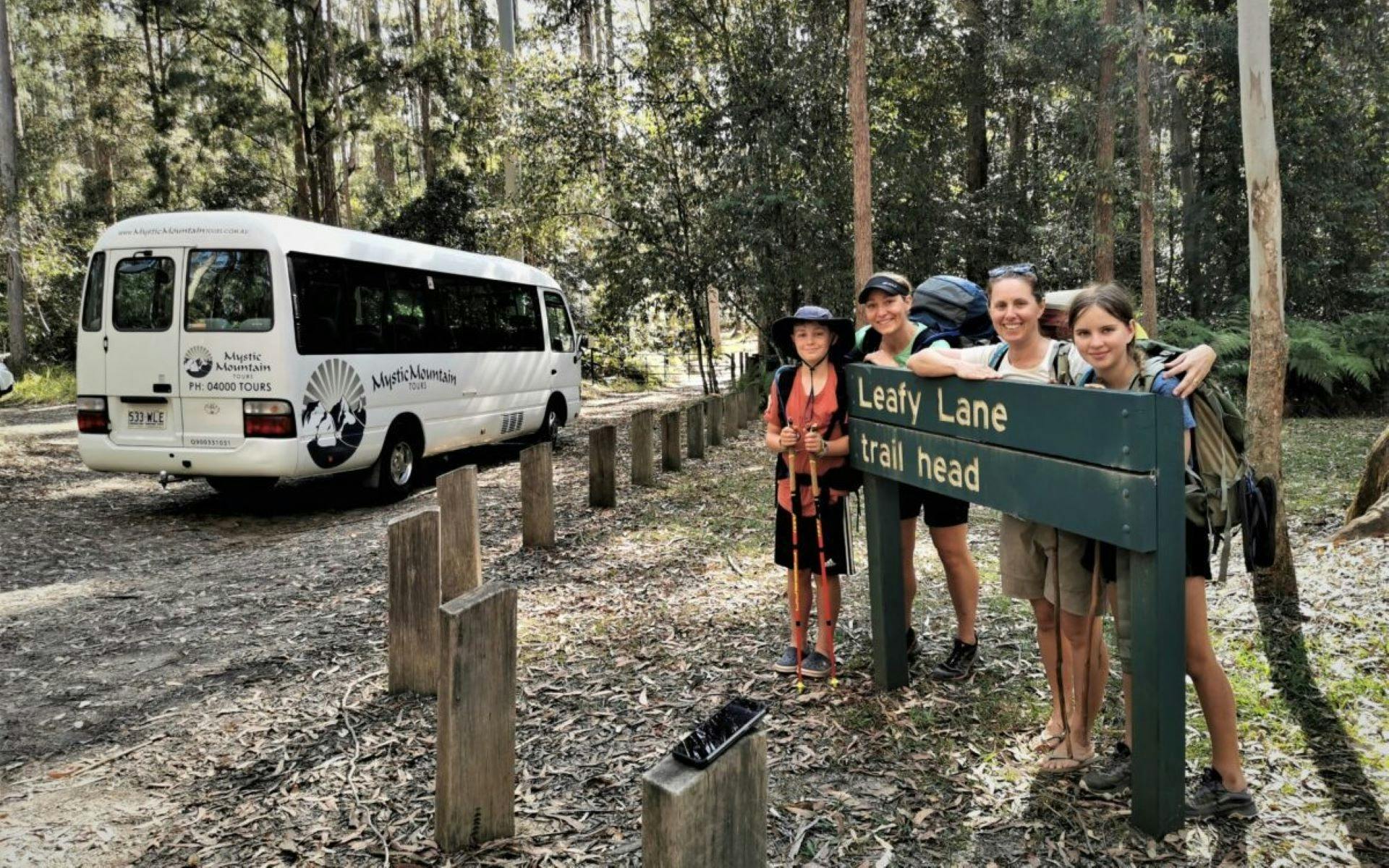 A family pose at the trailhead for their nature walk