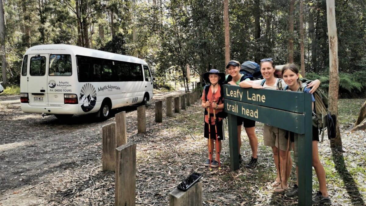 A family pose at the trailhead for their nature walk