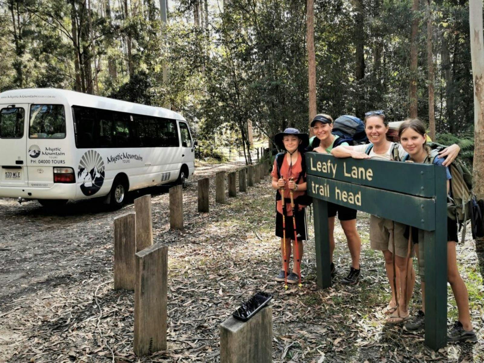 A family pose at the trailhead for their nature walk