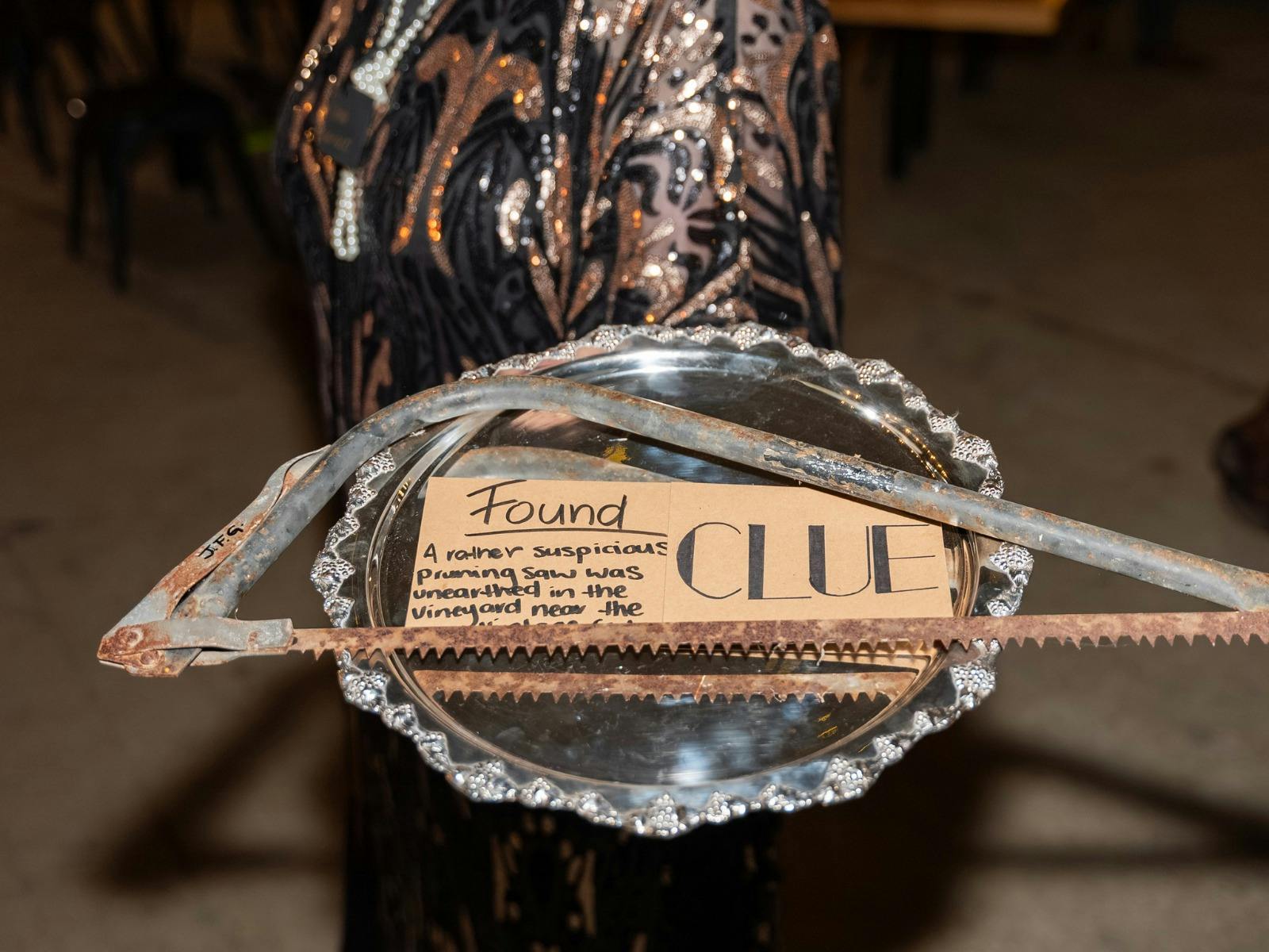 A clue from the Murder Mystery event on a tray